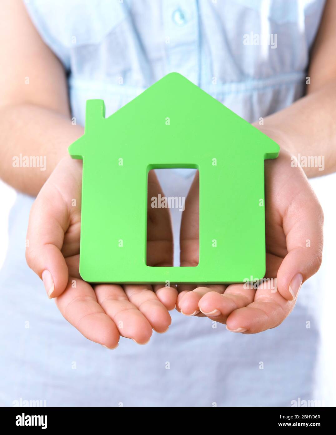 Female hands with small model of house, closeup Stock Photo - Alamy