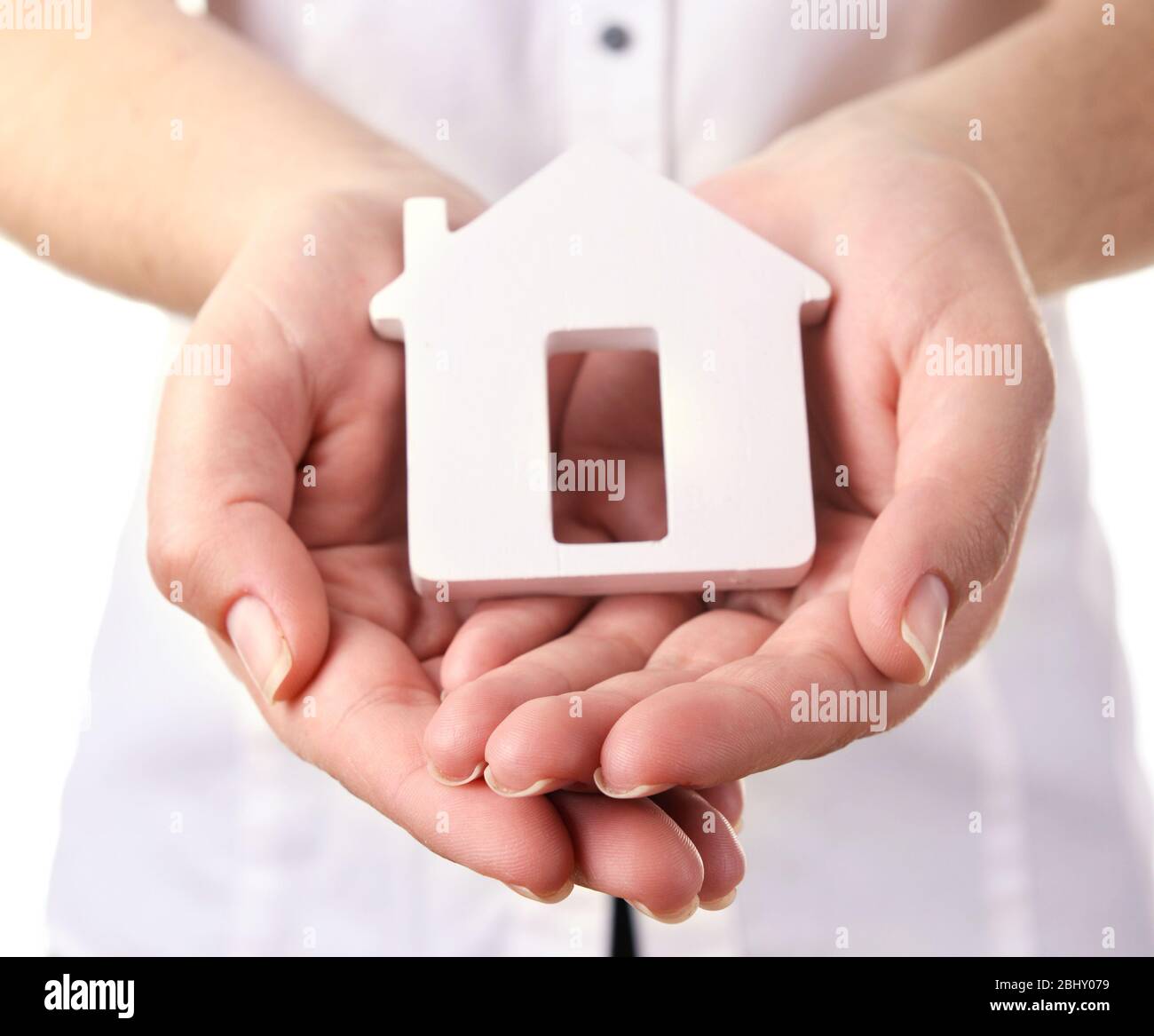 Female hands with small model of house, closeup Stock Photo - Alamy