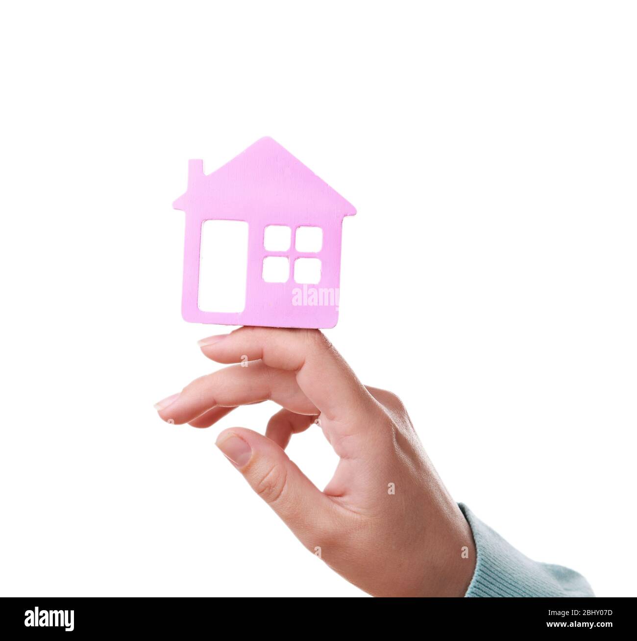 Female hand with small model of house isolated on white Stock Photo - Alamy