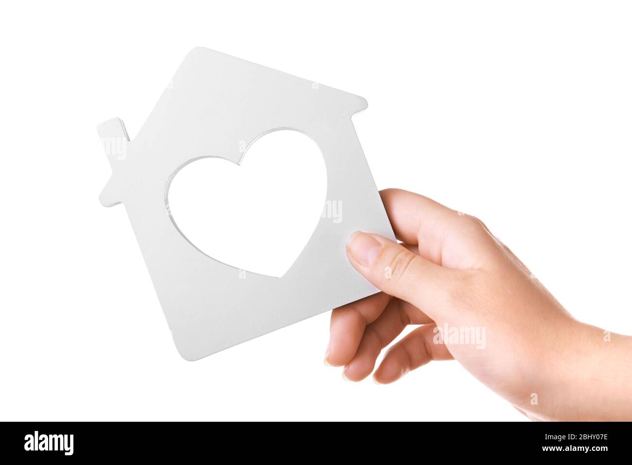 Female hand with small model of house isolated on white Stock Photo - Alamy