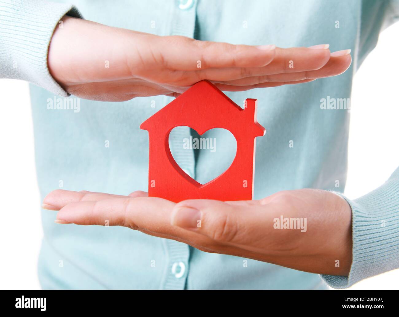 Female hands with small model of house isolated on white Stock Photo ...