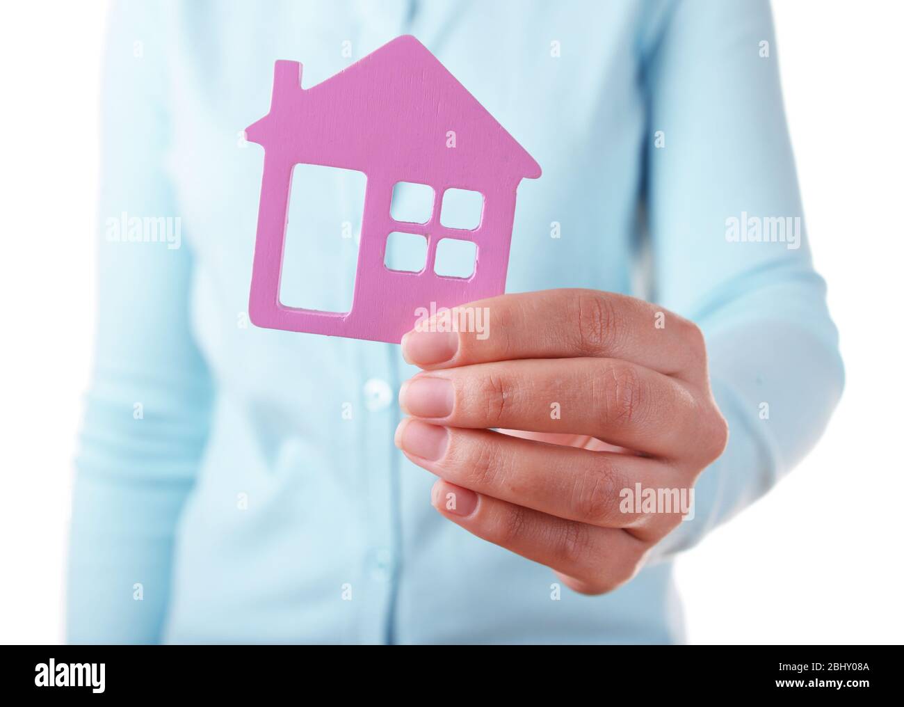 Female hand with small model of house isolated on white Stock Photo - Alamy