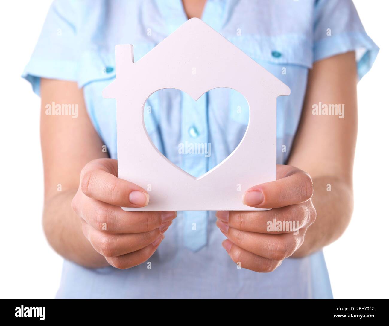 Female hands with small model of house isolated on white Stock Photo ...