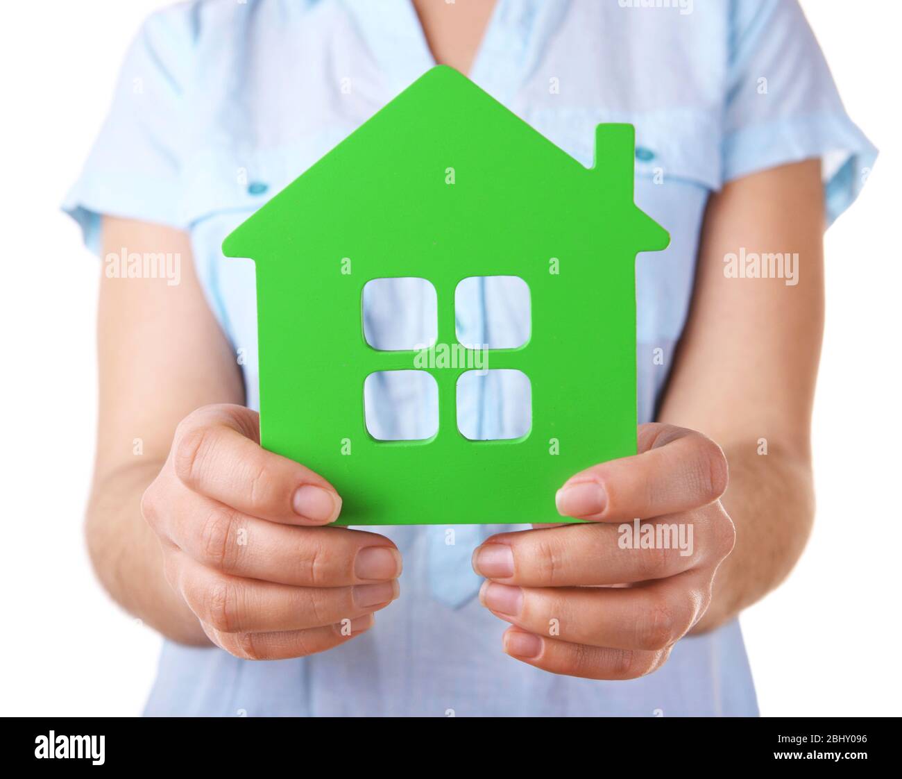 Female hands with small model of house isolated on white Stock Photo ...