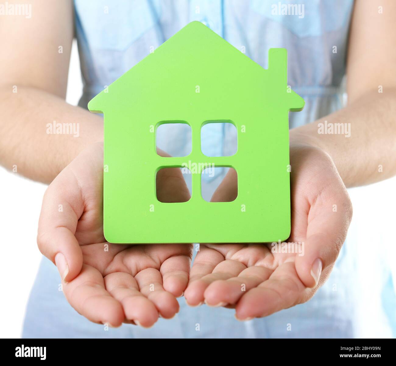 Female hands with small model of house, closeup Stock Photo - Alamy