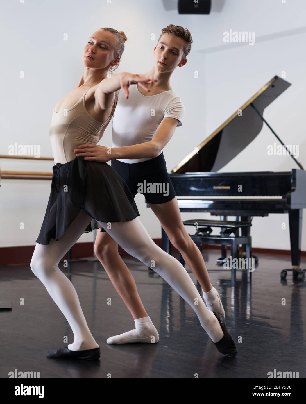 Ballet partners dancing gracefully together in the ballet studio Stock ...