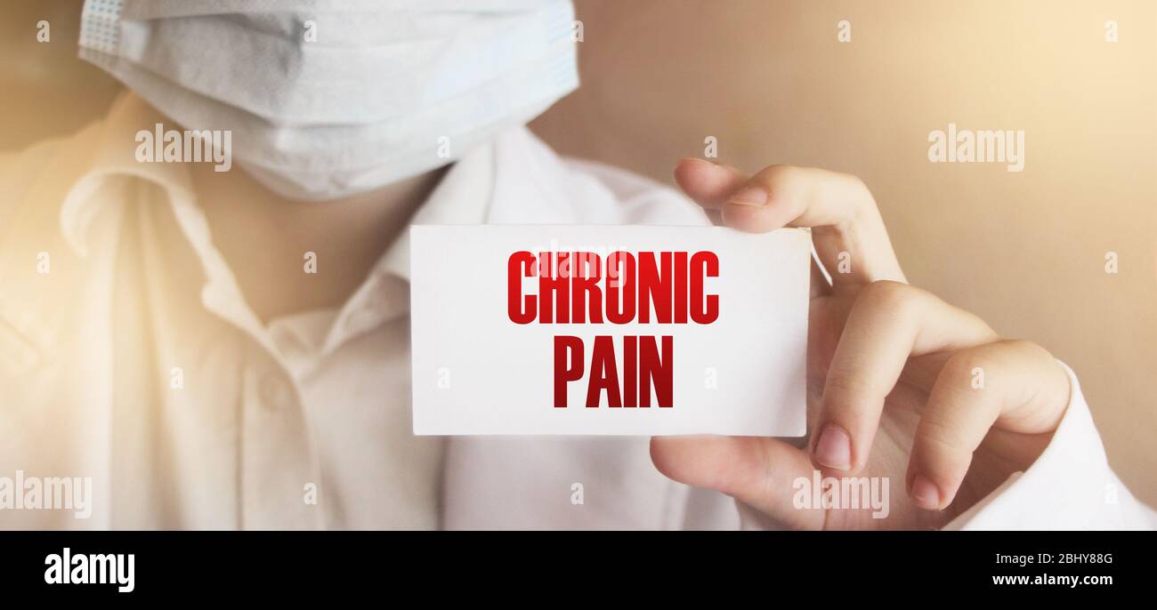 Chronic Pain card in hands of Medical Doctor. Healthcare concept Stock Photo
