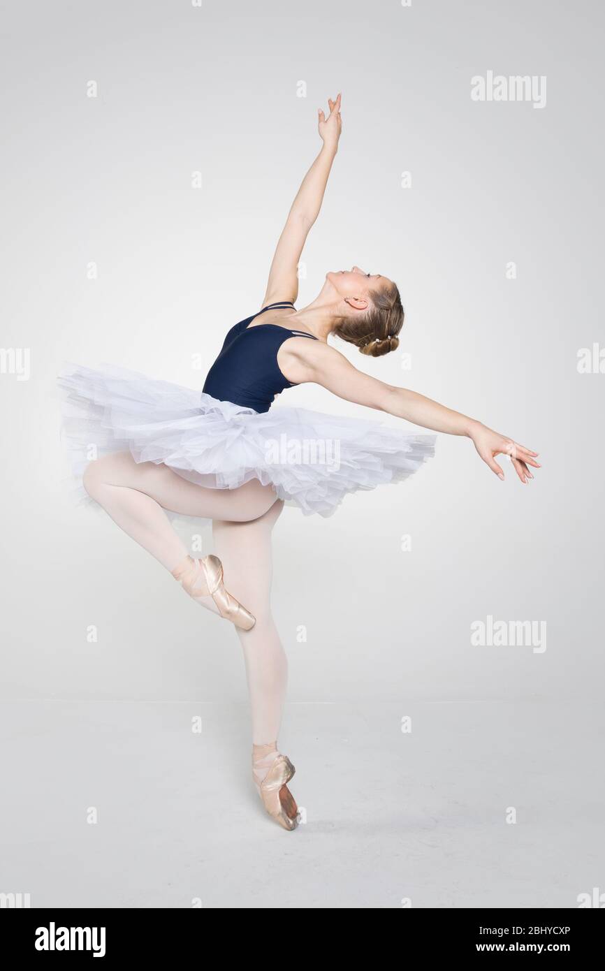 Young ballerina practising ballet moves in the studio Stock Photo - Alamy