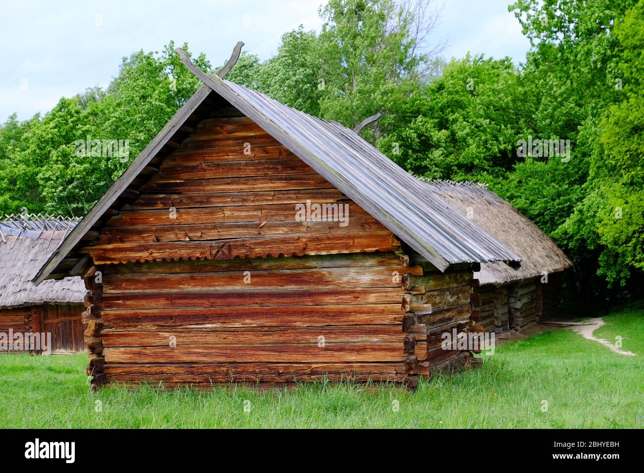 Wooden house in forest Stock Photo - Alamy