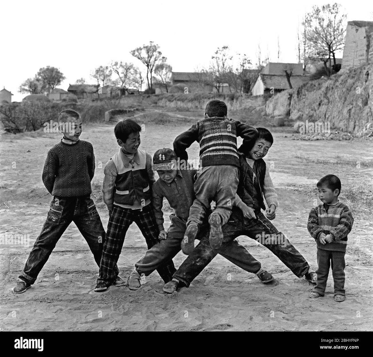 In 2004 Pingliang a rural child in Gansu Province played a game ofblocking the wall Stock Photo