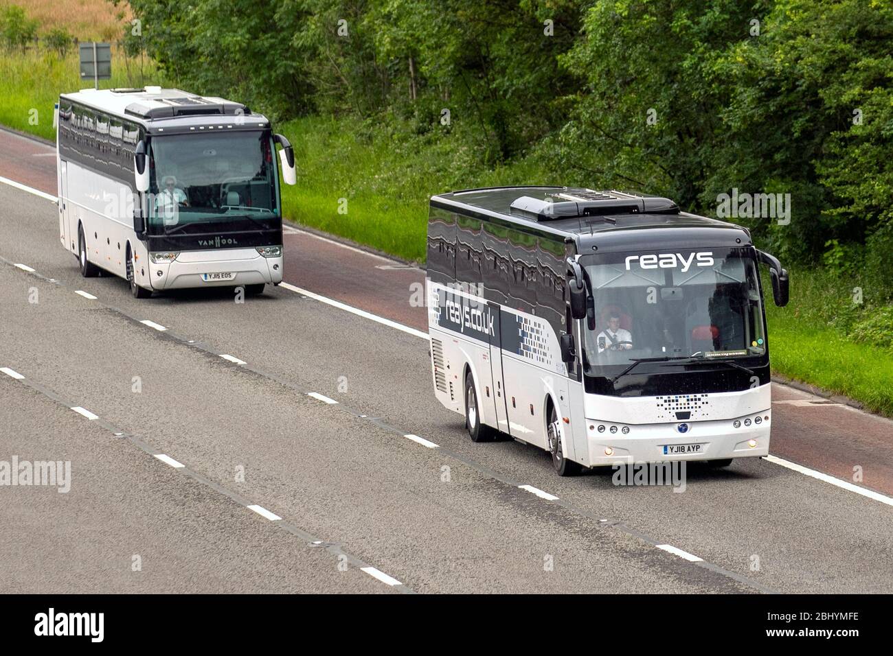 Reays 2018 multi-coloured Temsa Safari HD Auto;  PSV single deck coaches travelling on the M6 motorway, UK Stock Photo