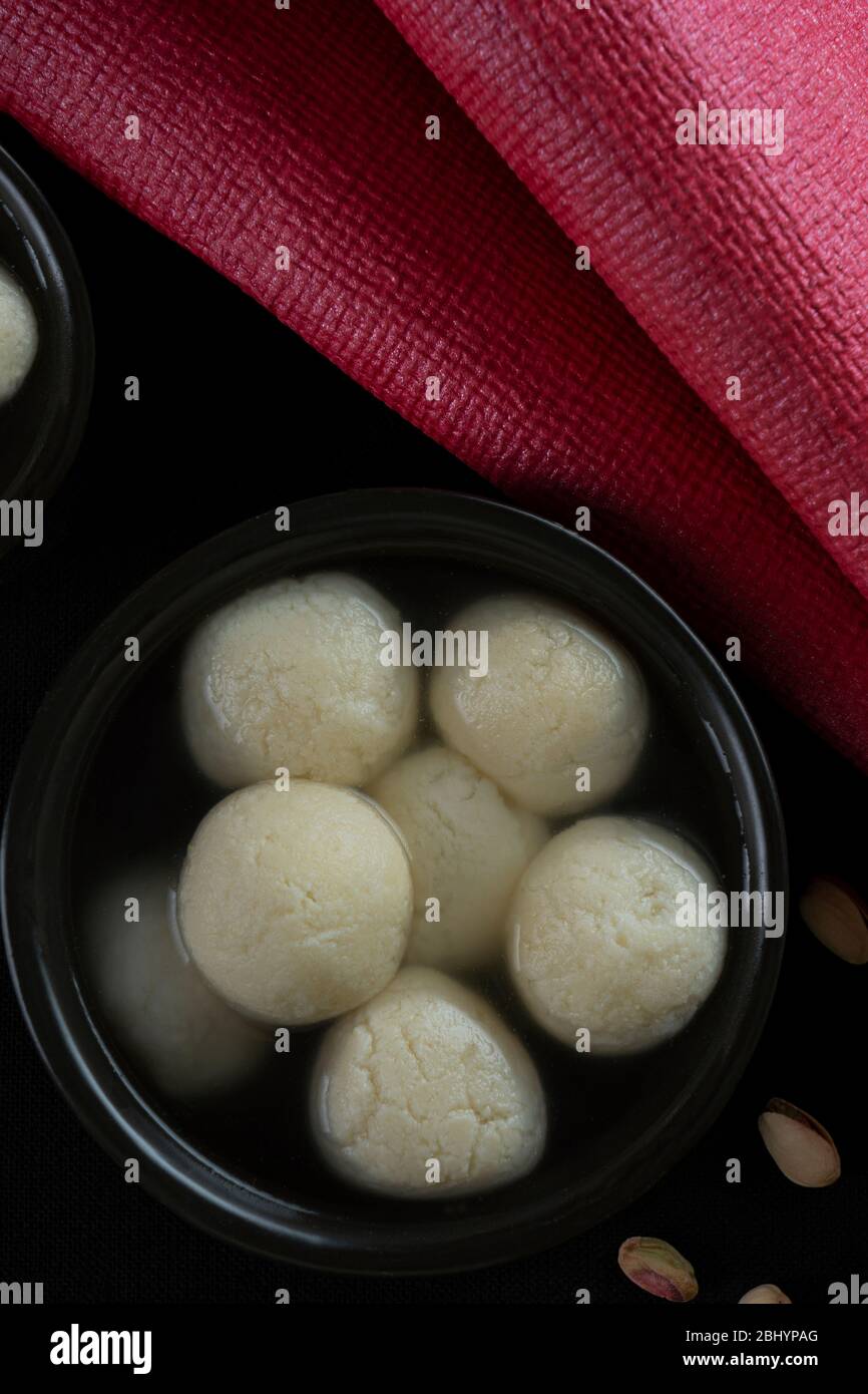 Mouth watering white rasgullas kept in a black bowl Stock Photo Alamy