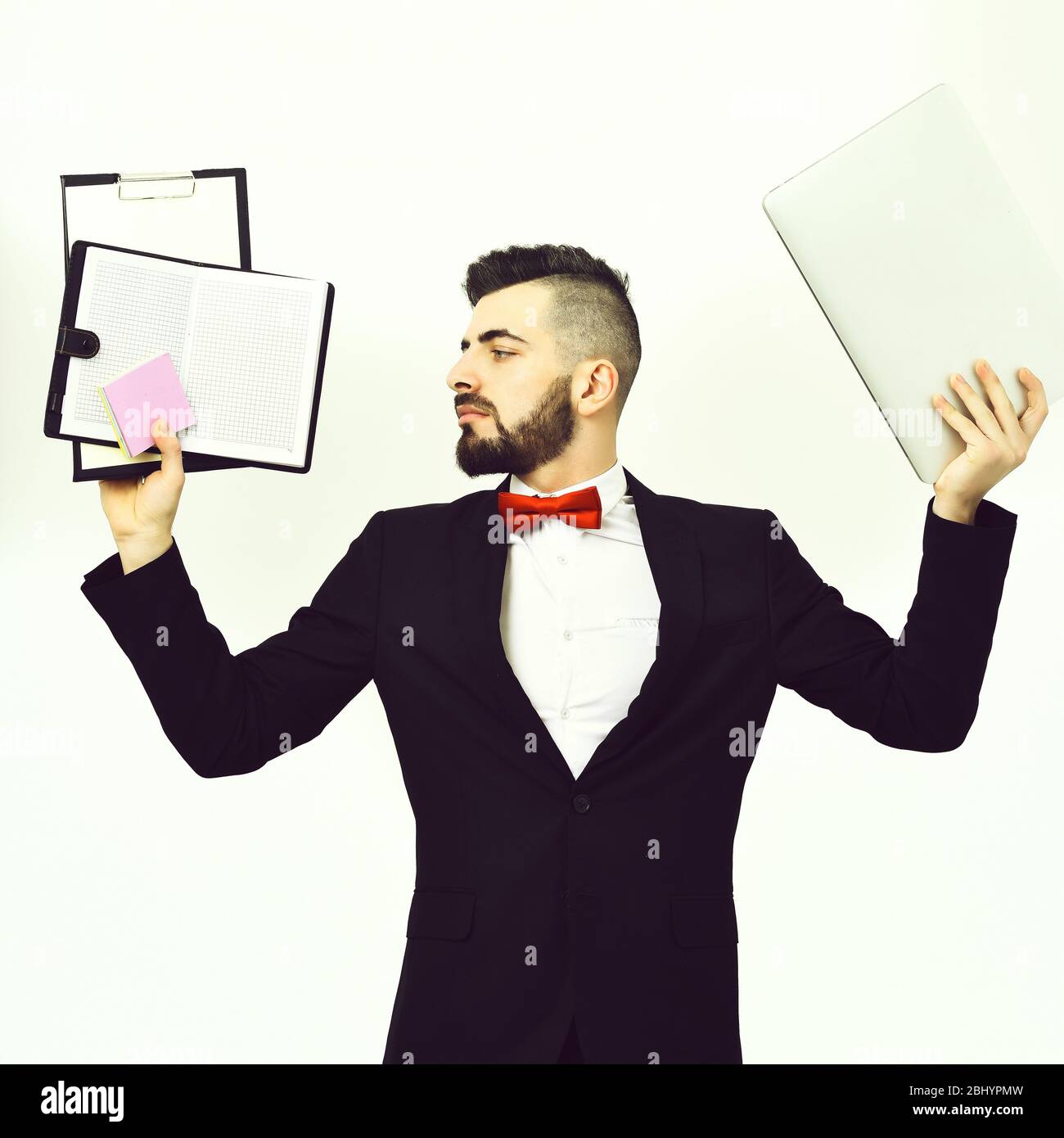 Project manager having busy look holds clip folder with blank paper ...