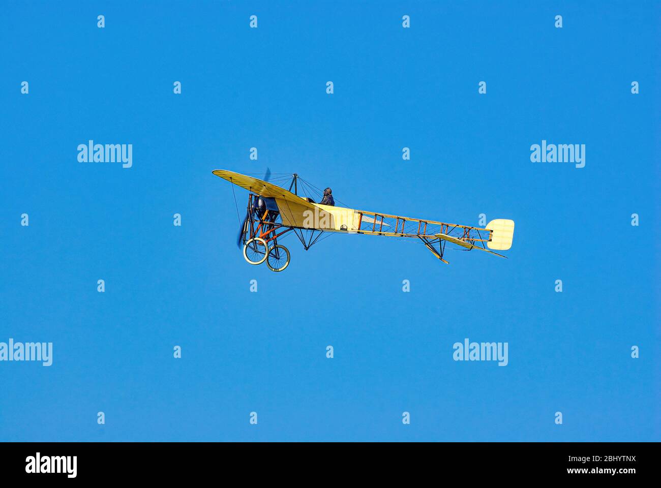 Fly-by of a classic aircraft, a replica of the Bleriot XI, at the Hahnweide 2011 Classic Aviation Meeting. Stock Photo