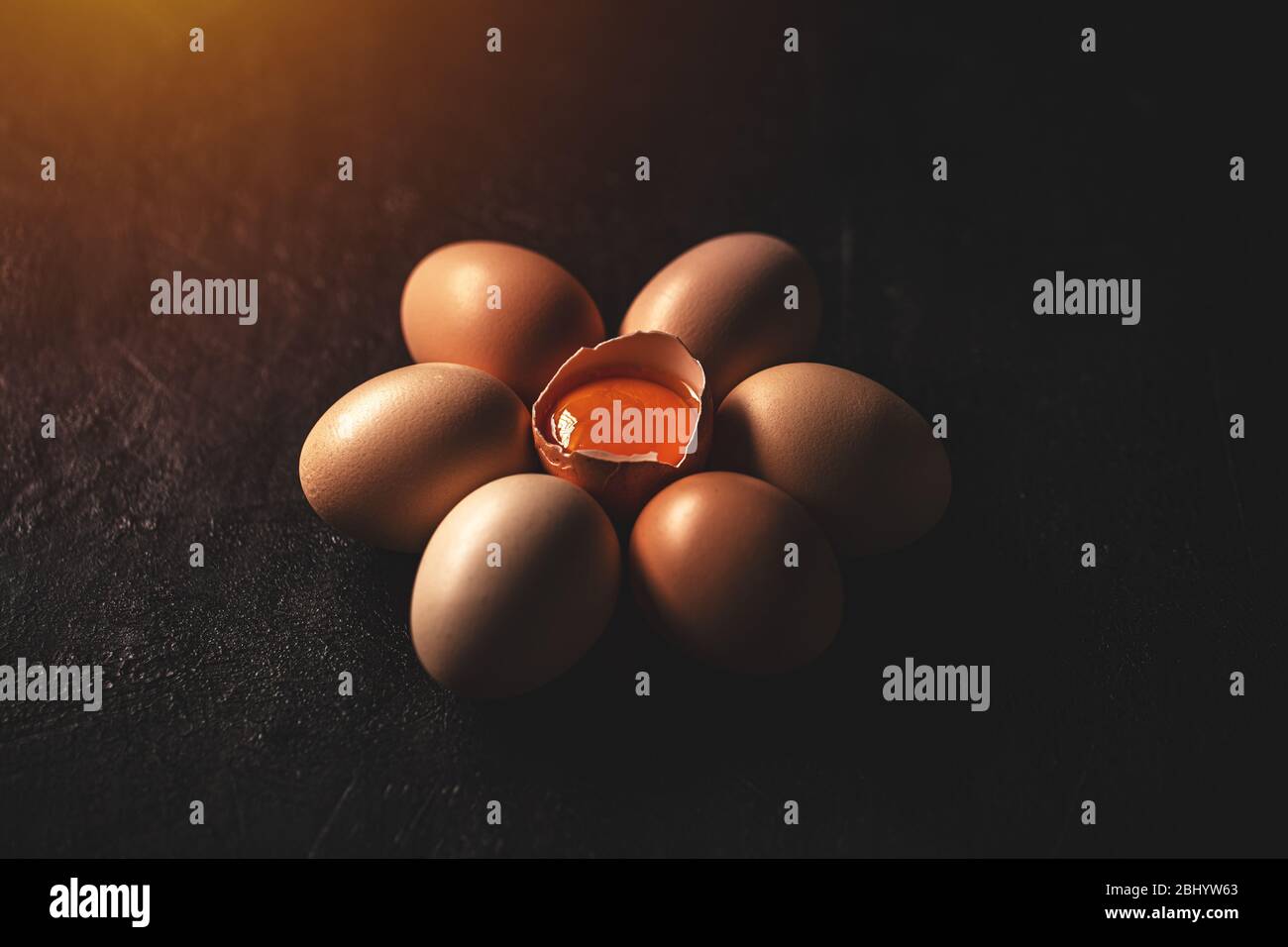 Raw chicken eggs on dark background, close up Stock Photo