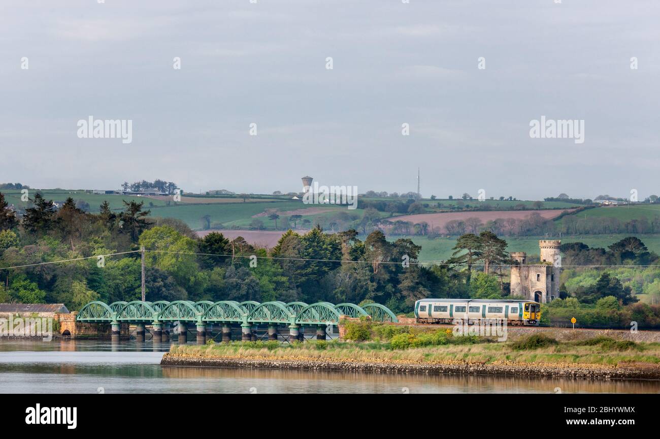 Fota Island, Cork, Ireland. 28th April, 2020. An early morning train from Cobh travelling to Kent Station passing the Castle on Fota Isalnd in Co. Cork, Ireland. - Credit; David Creedon / Alamy Live News Stock Photo