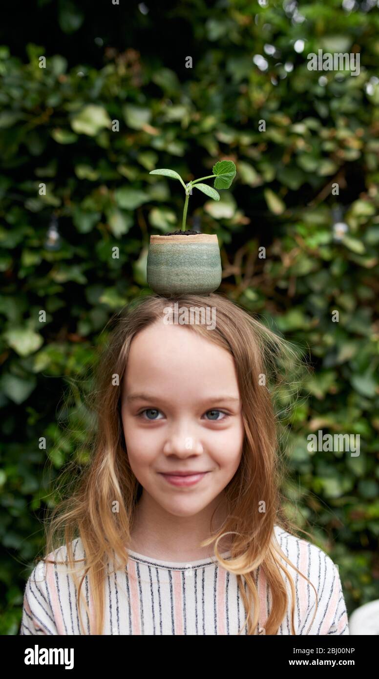Girl child plant pot hires stock photography and images Alamy