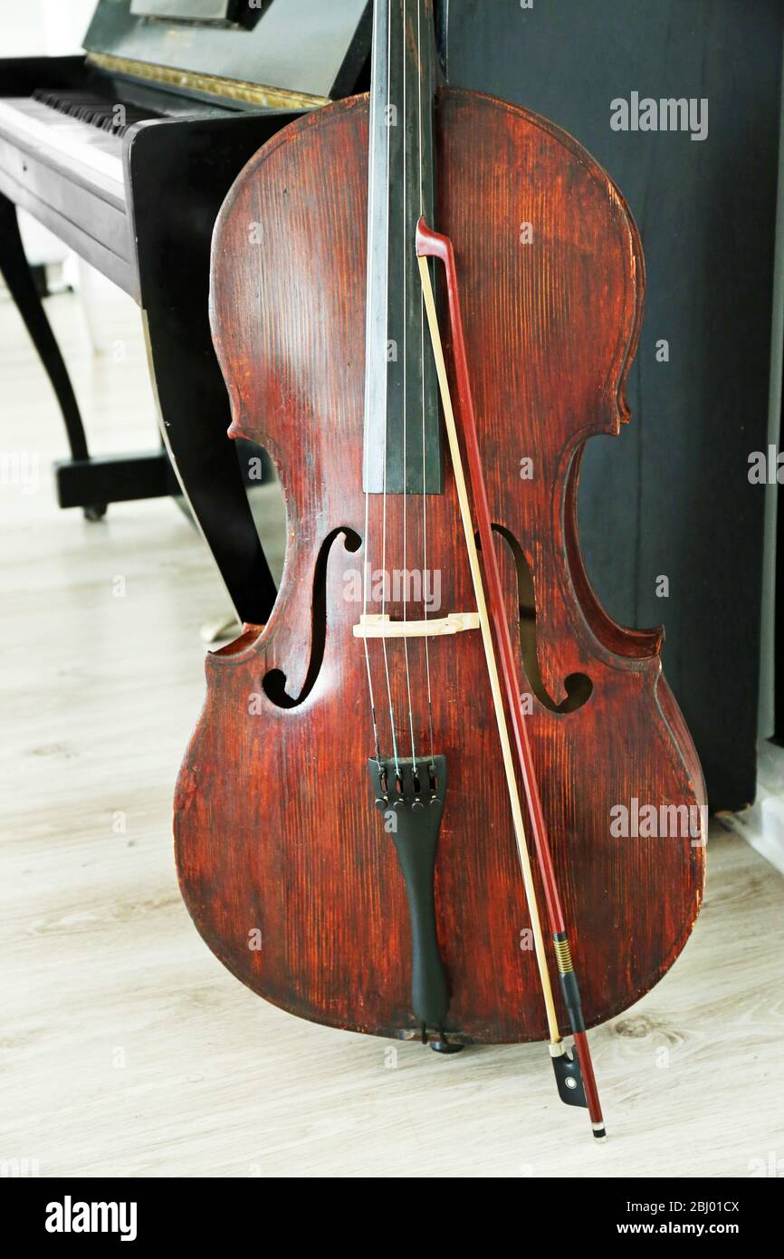 Cello near piano, indoors Stock Photo Alamy