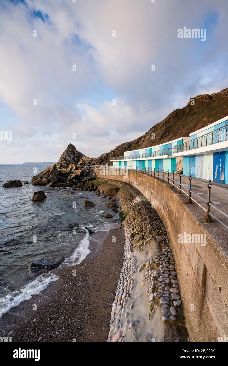 A row of beach huts at Meadfoot Beach, Torquay, Devon, UK Stock Photo