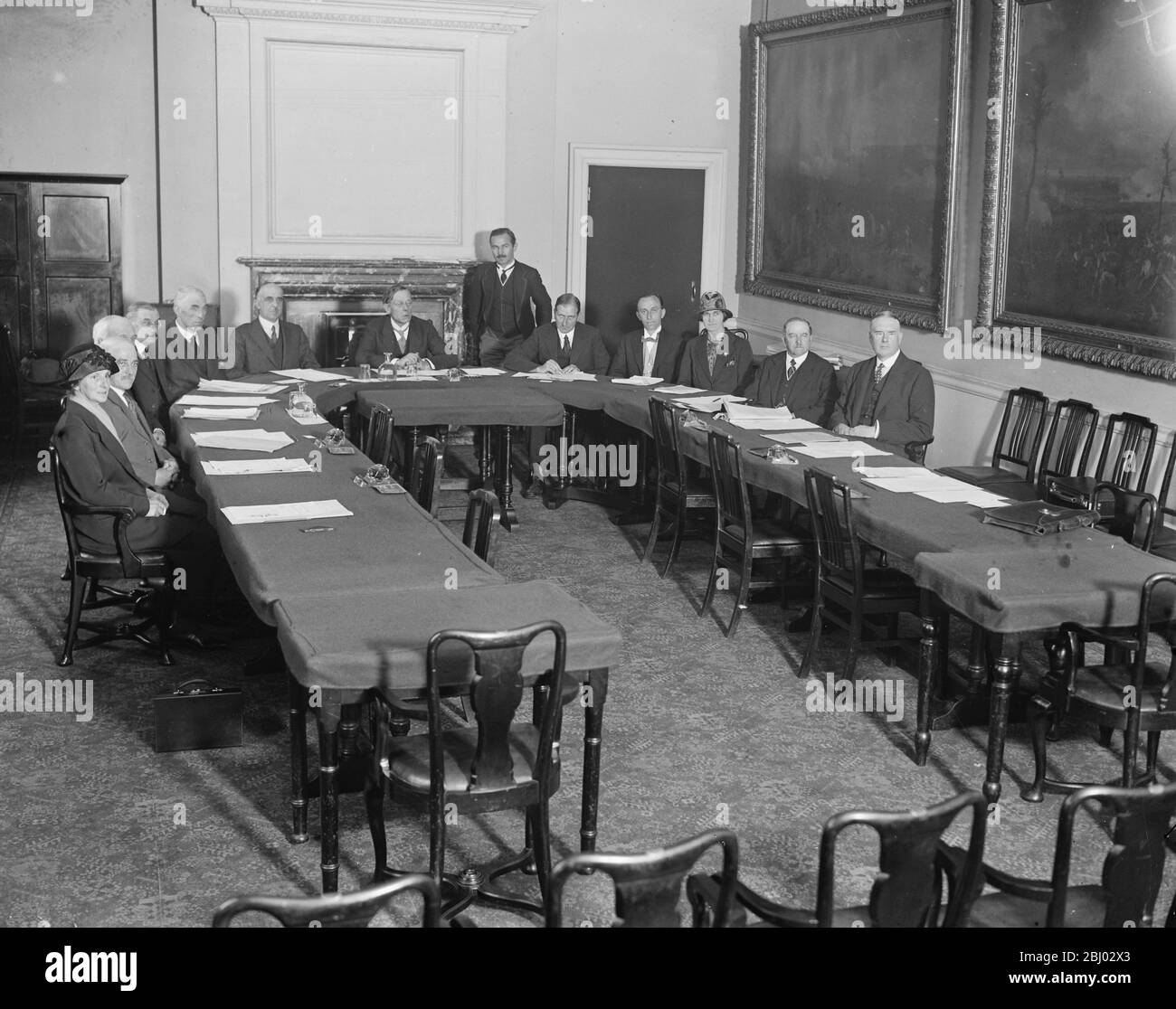 First meeting of the new food council . - Lord Bradbury presiding . On his left are Mr G A Powell , Sir John Lorne MacLeod , Mr W E Dudley , Mr C H Bird , Mr F W Birchenough , and Mrs A Wilson , and on his right , Mr F St Q Hill ( secretary ) , Mr A E Faulkner , Sir Gilbert Garnsey , Mrs B M Dapper , Mr Isaac Stephenson , and Mr C S Orwir . - 31 July 1925 Stock Photo