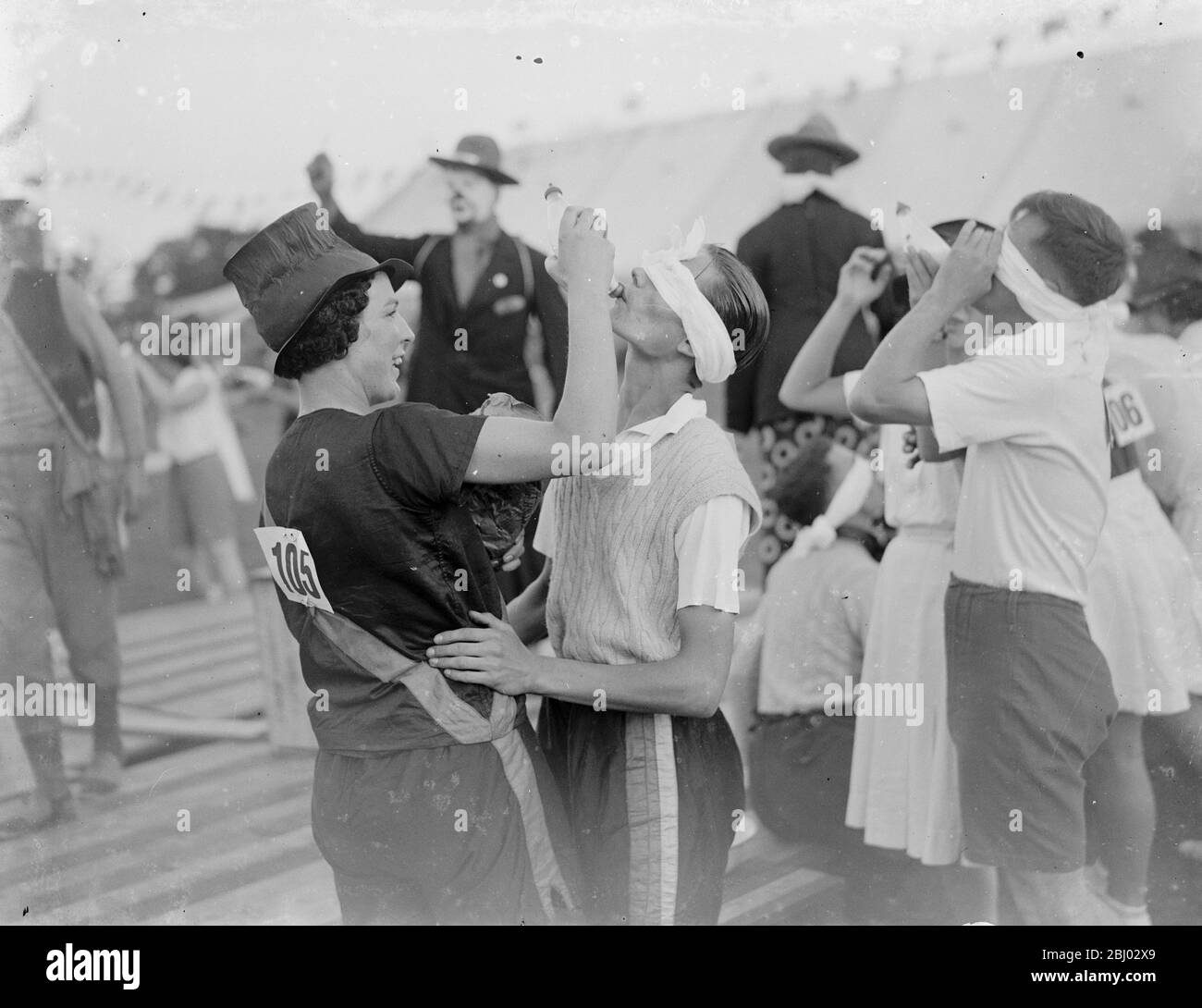 Milk bottle drinking contest . - 1935 . Stock Photo