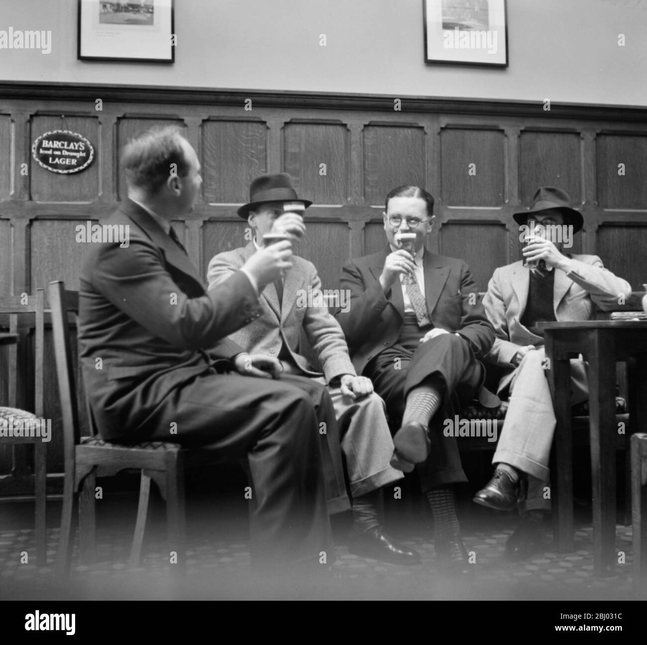 Mr John Topham drinking with friends . - 1936 Stock Photo
