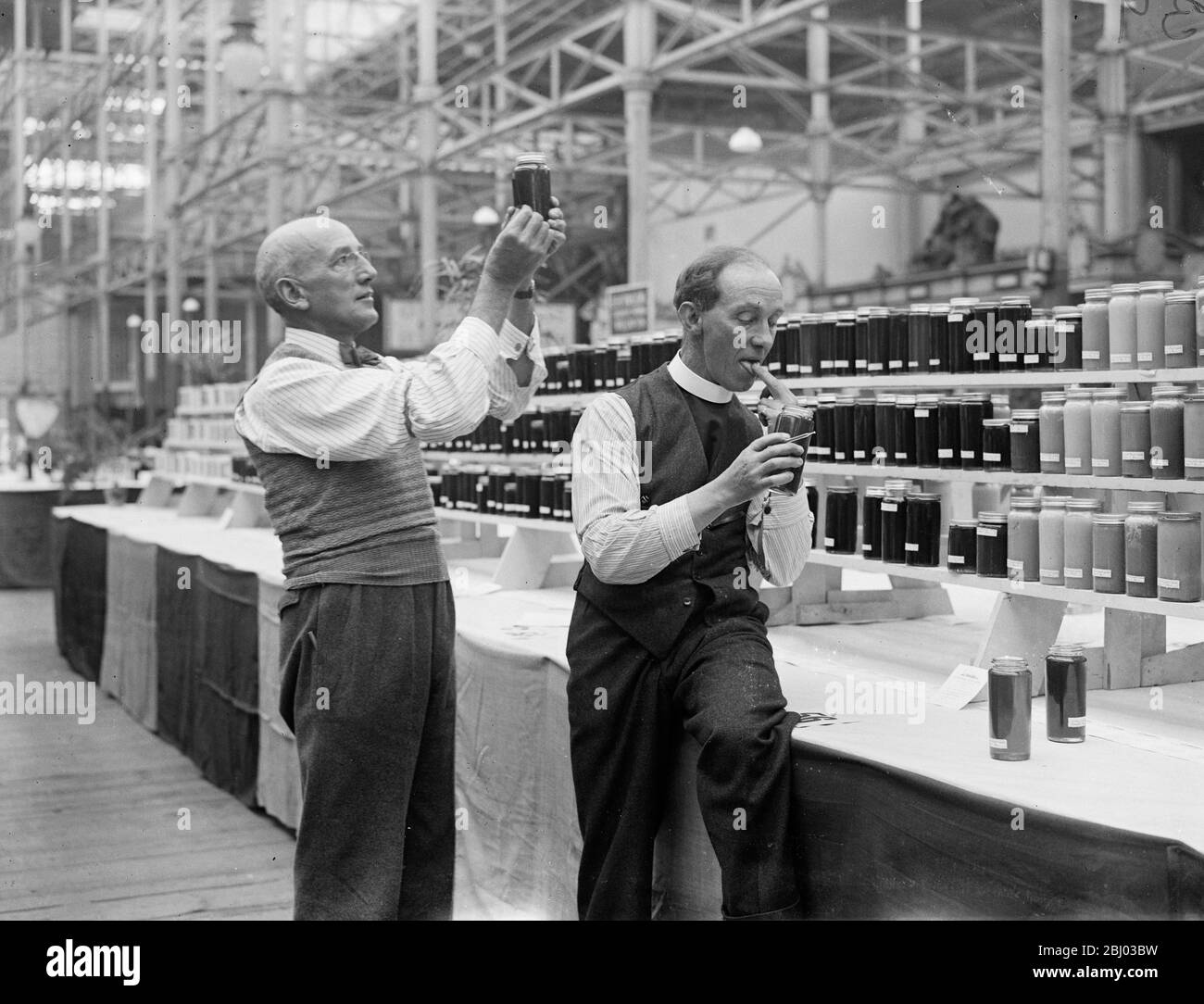 Judging honey at Crystal Palace show . 1934 Stock Photo Alamy