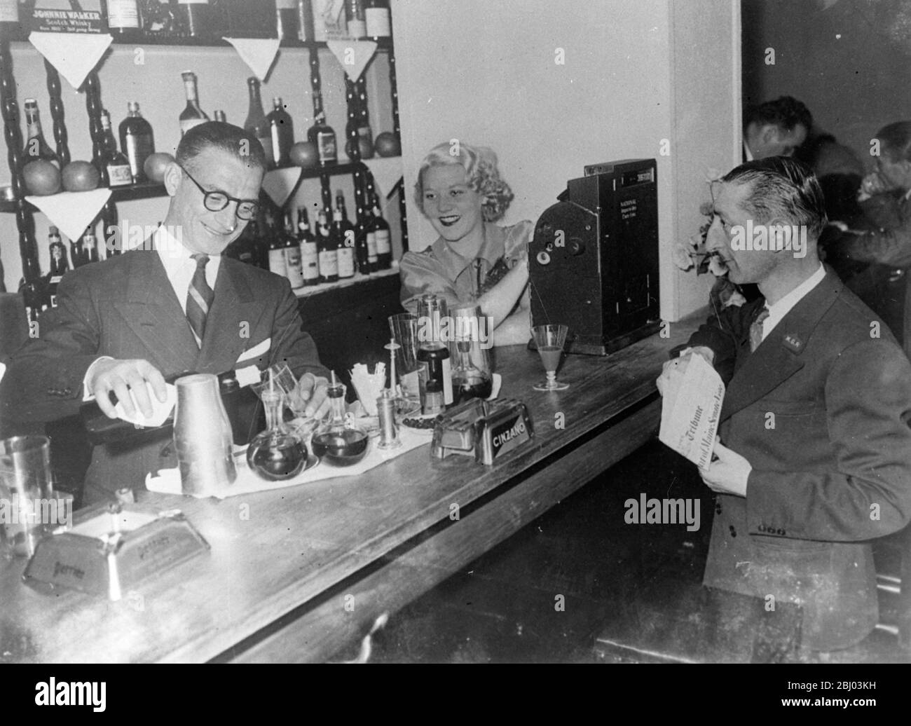 Stravinsky's secretary now runs cocktail bar with London dancer as hostess . - Gilbert Ramognie , former secretary of Serge Stravinsky , the French Swindler , has now opened a cocktail bar called ' Merry go Round ' , in the Rue de Berri just off the Champs Elysees , Paris . Romaginno was acquitted on charges of receiving stolen money after spending 23 months in prison . - The hostess of the new bar is Madame Romagnino , the former Celia Nano , London dancer who was questioned by Scotland Yard officials in connection with the Stravinsky's case . - The doorman of the bar is Henry Voix who was St Stock Photo