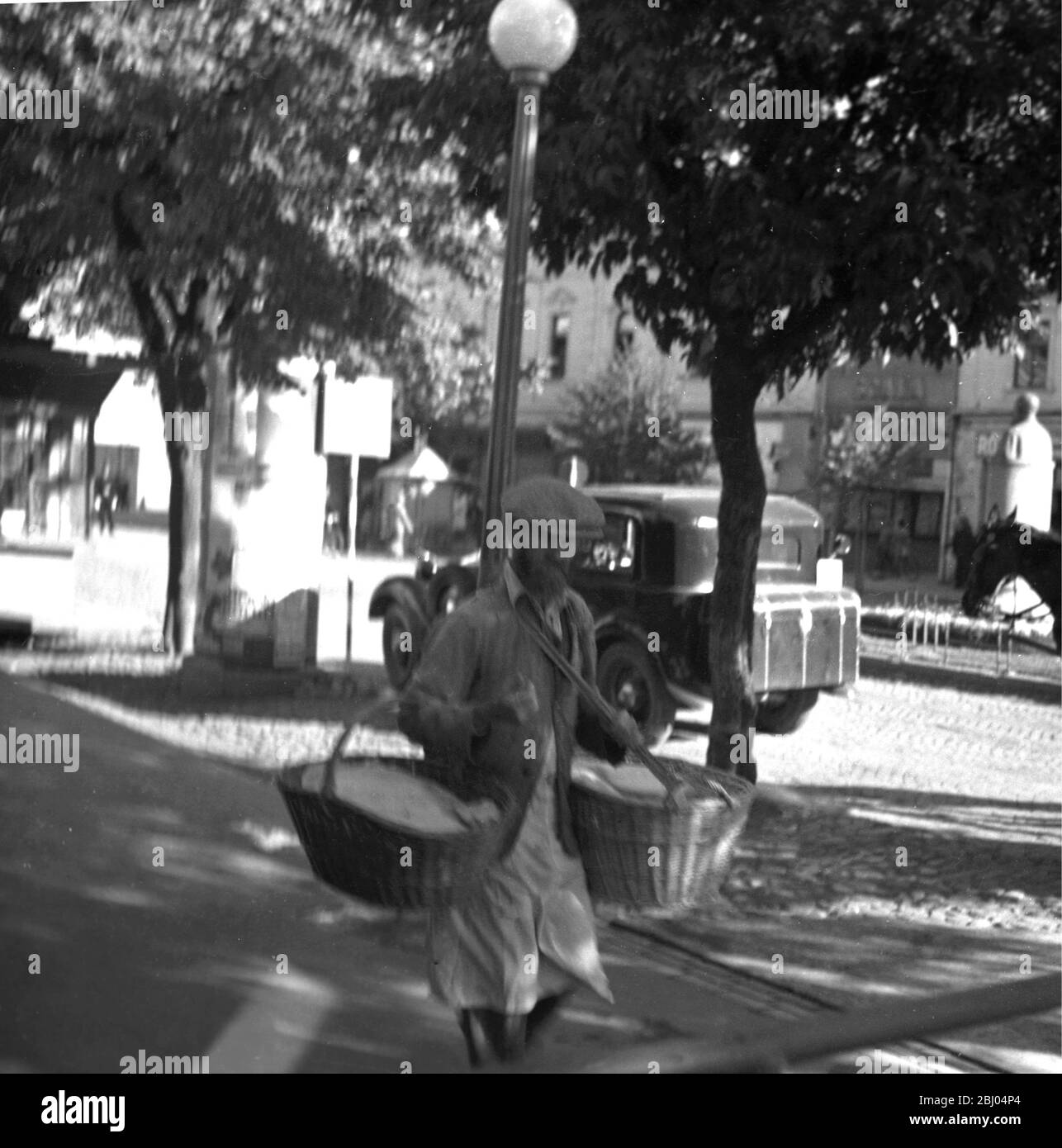 Ruthenia - baker boy delivering fresh bread in basket - photograph taken in 1938-39 in an area bordering Poland and the Ukraine, known as Ruthenia. The people were Jewish or the indigenous Greek-Orthodox Ruthenes. They had a measure of autonomy under the Czechs between 1918 and 1938 but saw that disappear when the nazi-aligned Hungarians took over the region during World War II. After the war, half of the territory was ceded to Soviet-controlled Ukraine and the other half remained in Slovakia. - Stock Photo