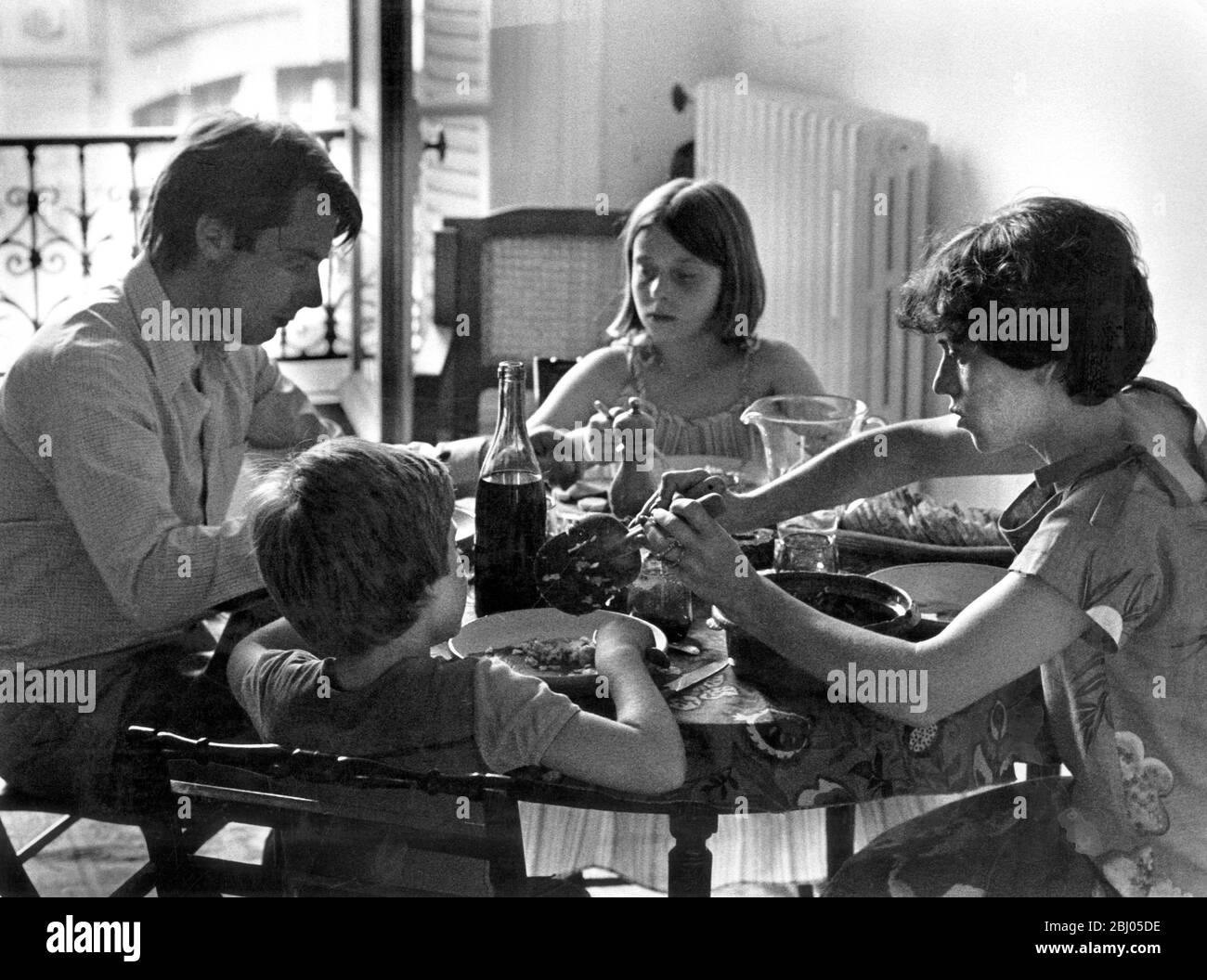 1970's family having dinner Stock Photo