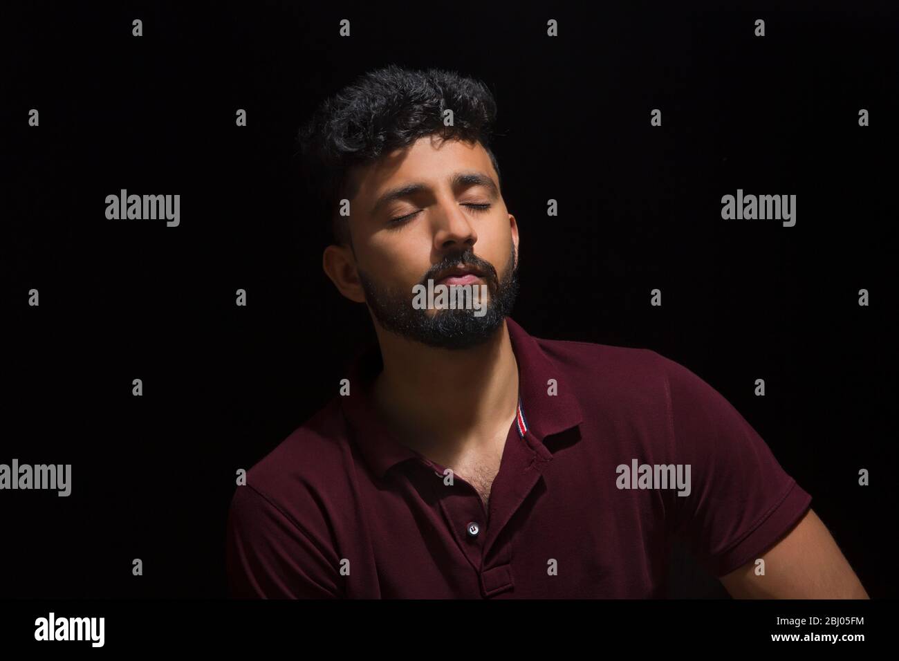 Sad man sitting in dark hi-res stock photography and images - Alamy