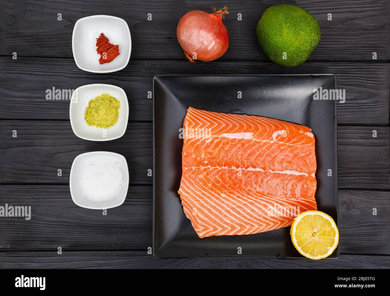 Salmon fillet black background hi-res stock photography and images - Alamy