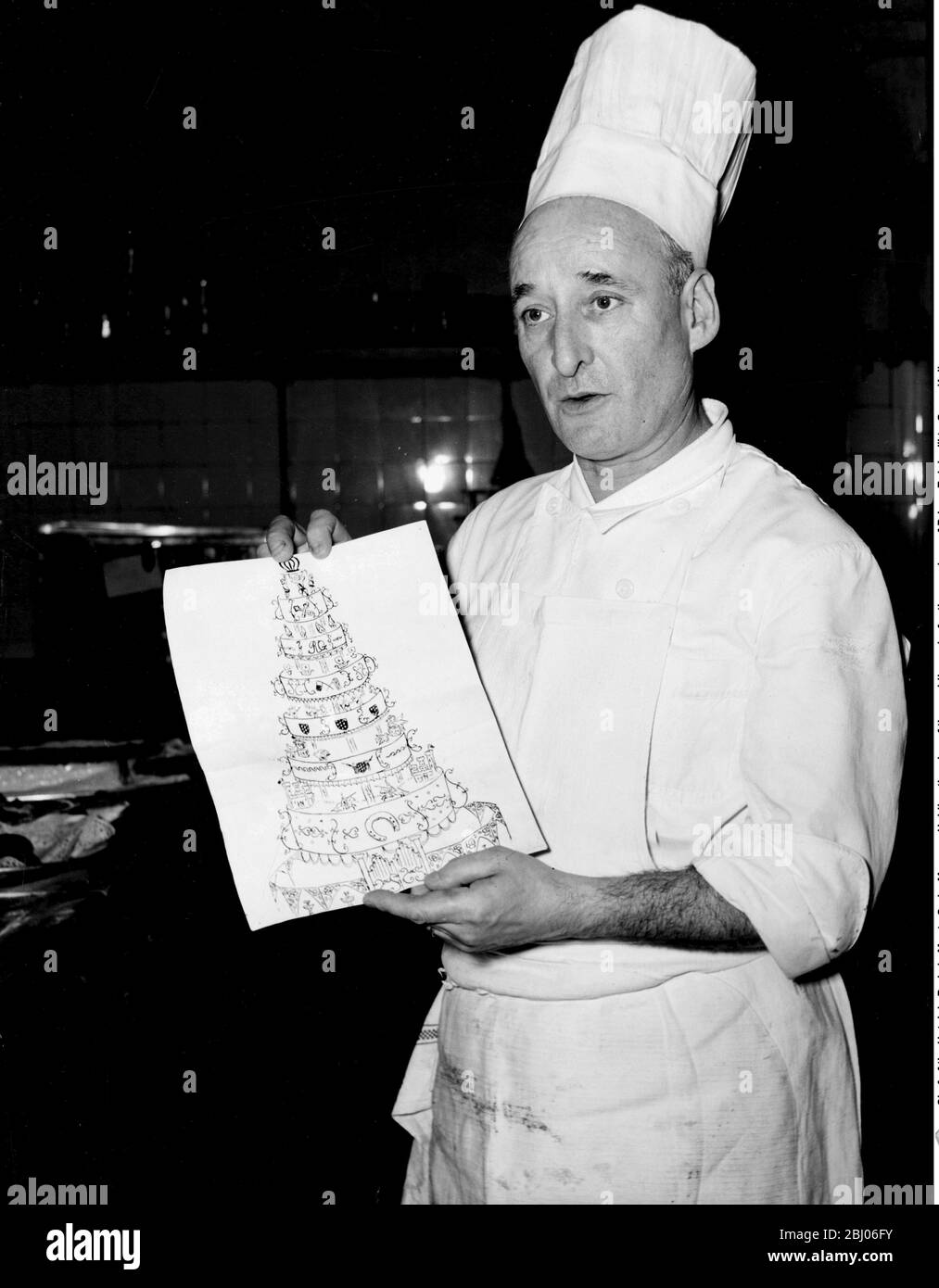 Chef of the Hotel de Paris in Monte Carlo, Monaco. Holding the plan of the wedding cake for the marriage of Prince Rainier III to Grace Kelly. Stock Photo