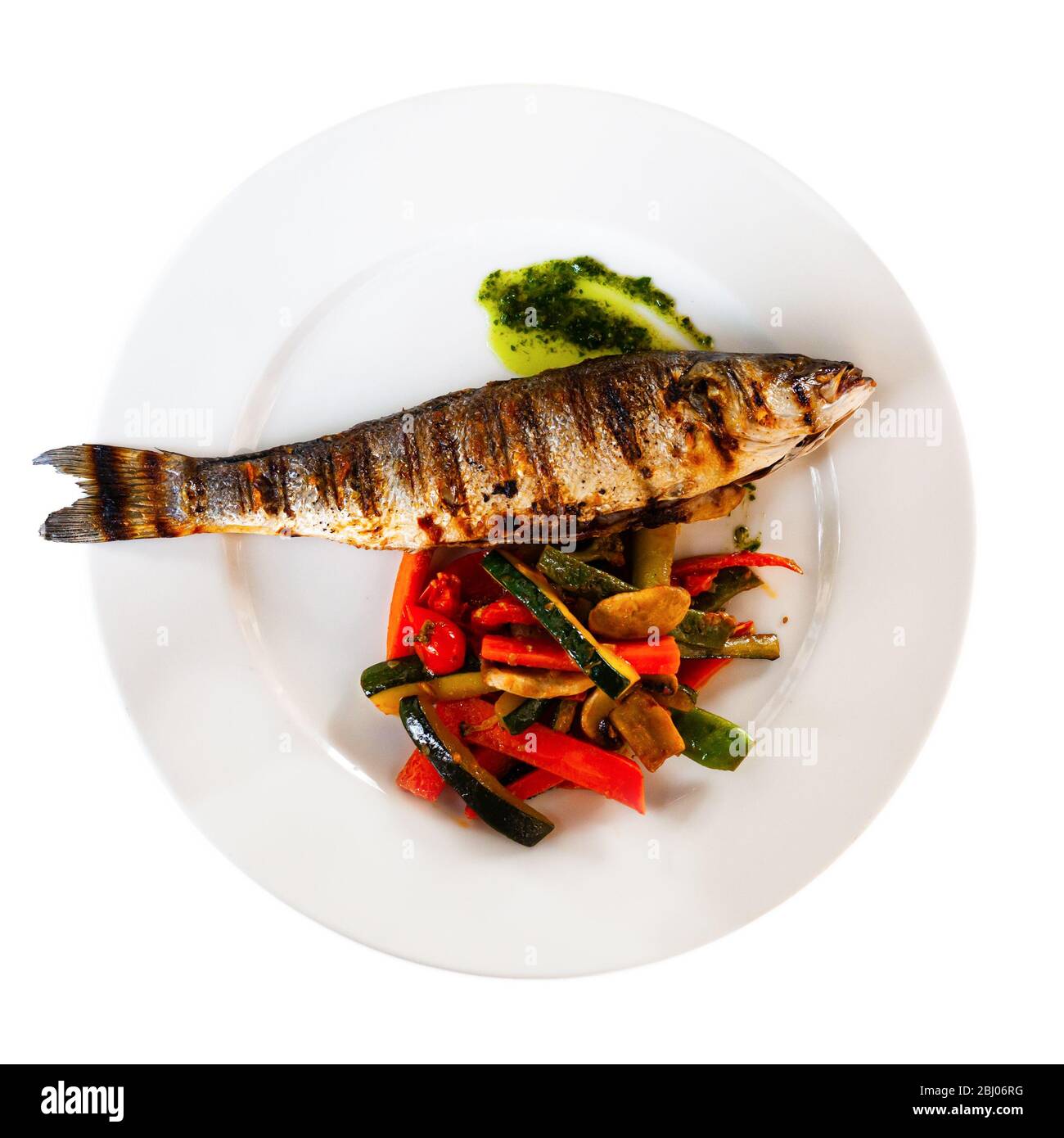 Delicious fish dish baked sea bass with stewed vegetables Stock Photo