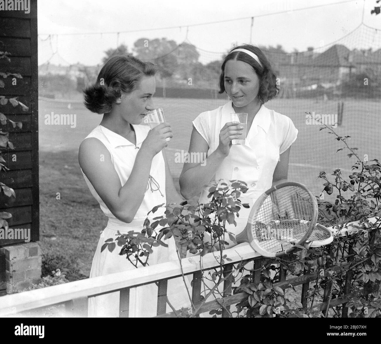 Middlesex Junior Championships at the Herga Club. - Miss K.A. Ferguson and Princess T. Wiasemsky (Bandeau), Granddaughter of Mr Selfridge. - 1935 Stock Photo