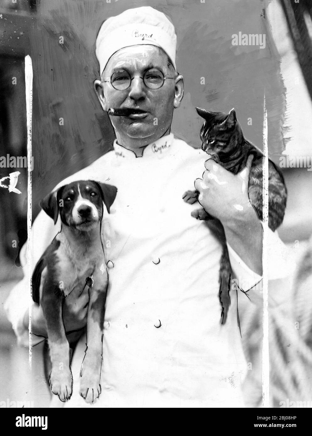 George W.Tennant, a member of the Byrd Antarctic Expedition, pictures with the cat and dog mascots of the city of New York Byrd ship that shipped for the South Polar Regions. Photographic expeditions and geological surveys were taken during the expedition. - 1928 Stock Photo
