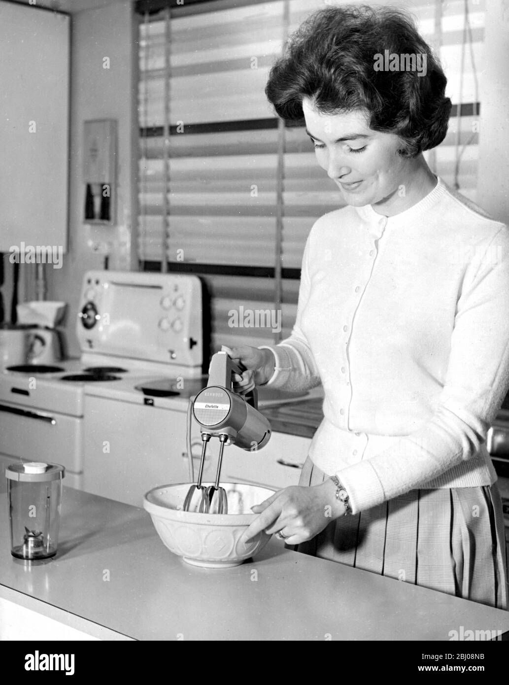 Chefette by Kenwood Electric Mixer. Mix,blend,puree,chop,make breadcrumbs and grind coffee. 110 -120 volts,200-220 volts, 230-250 volts A.C.. with three speed costs £11 0s 6d. - September 1961 - Stock Photo