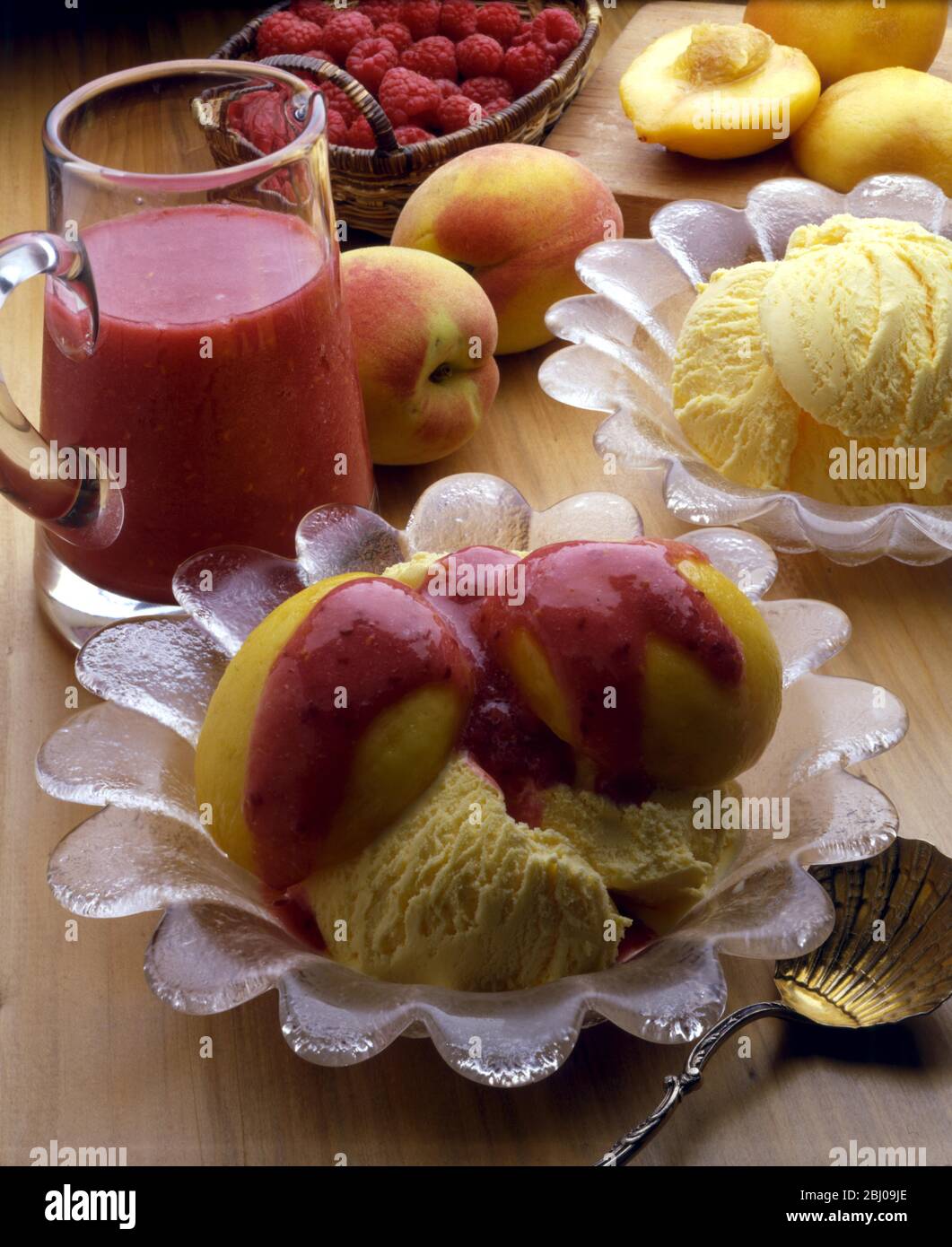 Peach Melba - Peach Melba was created by Auguste Escoffier at the Savoy Hotel in London for Dame Nellie Melba who was living there for a time. Stock Photo
