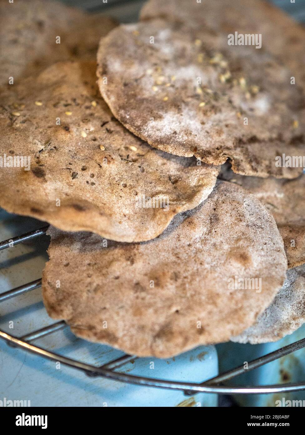 Homemade buckwheat crispbreads, drying on old Rayburn Stock Photo