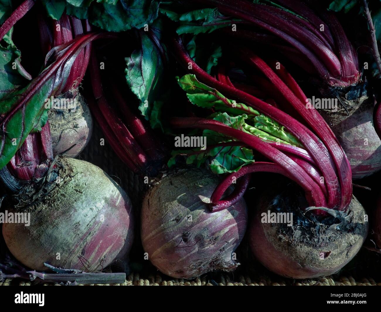 Fresh whole raw beetroot for sale in box outside traditional greengrocers shop - Stock Photo