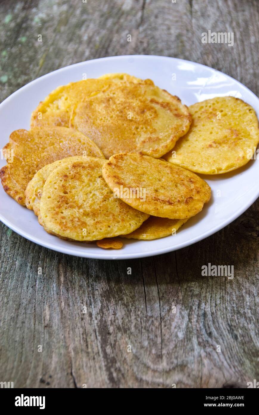 Little pancakes made of indian chick pea flour (chana dal), gluten free and very nutritious. - Stock Photo