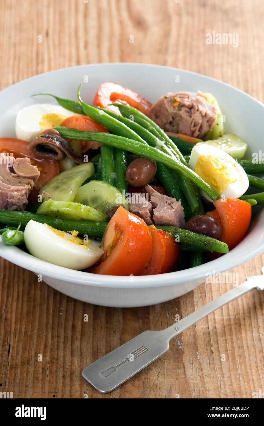 Classic salade Nicoise: tuna, green beans, olives, hardboiled eggs, - Stock Photo