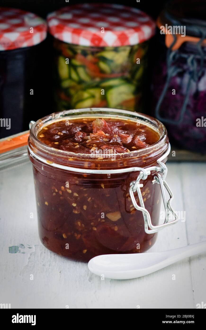 Home made jar of tomato chutney - Stock Photo