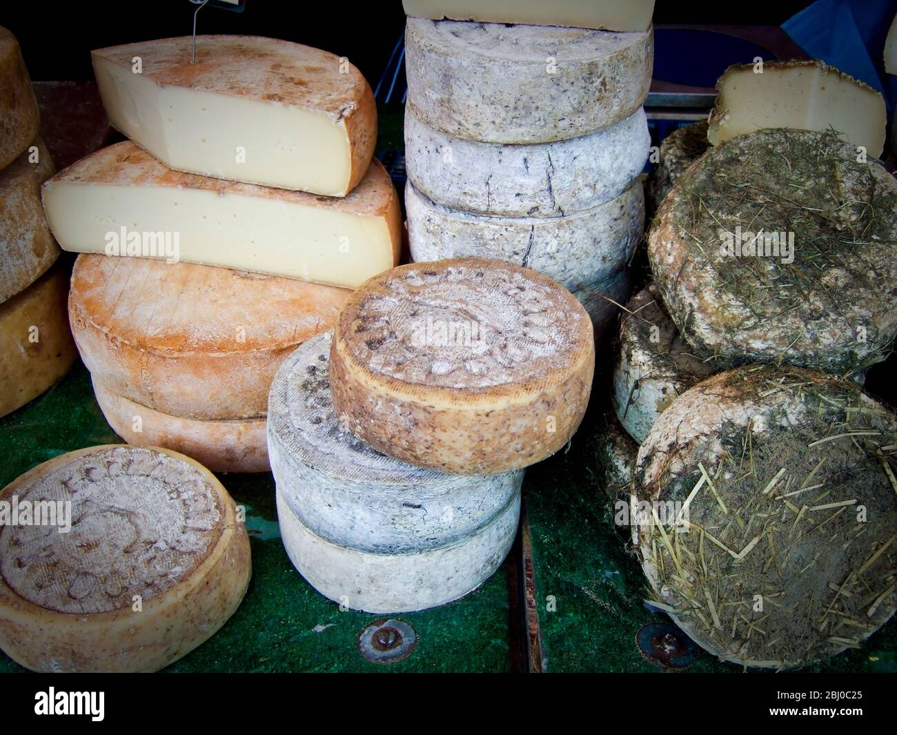 Italian cheeses on market stall in Edenbridge Kent - Stock Photo