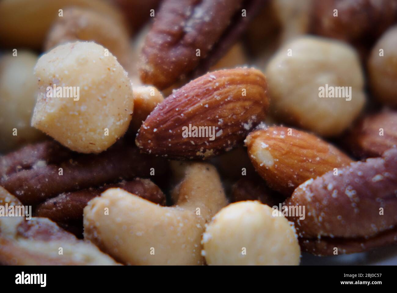 Selection of mixed salted nuts Stock Photo Alamy