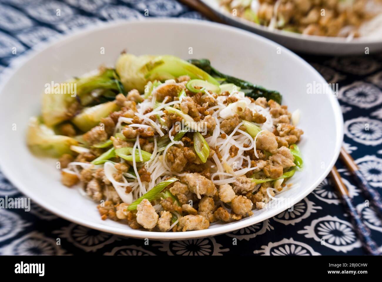 Larb - a Thai dish of minced pork, fried with garlic, grated fresh ginger, chilli pepper, and dressed in lime juice and thai fish sauce (Nam Pla). The Stock Photo