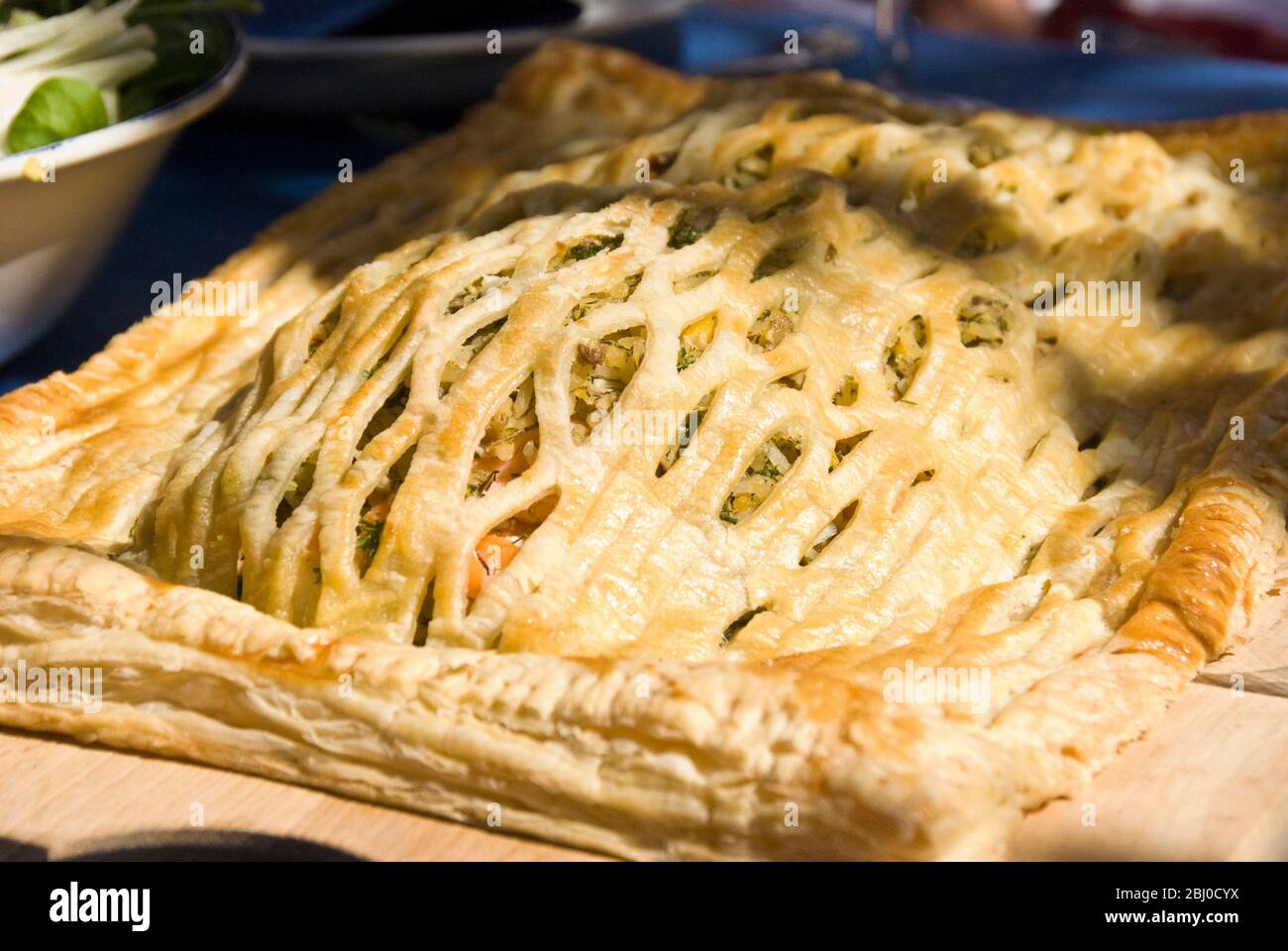 Salmon koulibiac - slamon fillets and rice in puff pastry case - a traditional russian dish - Stock Photo