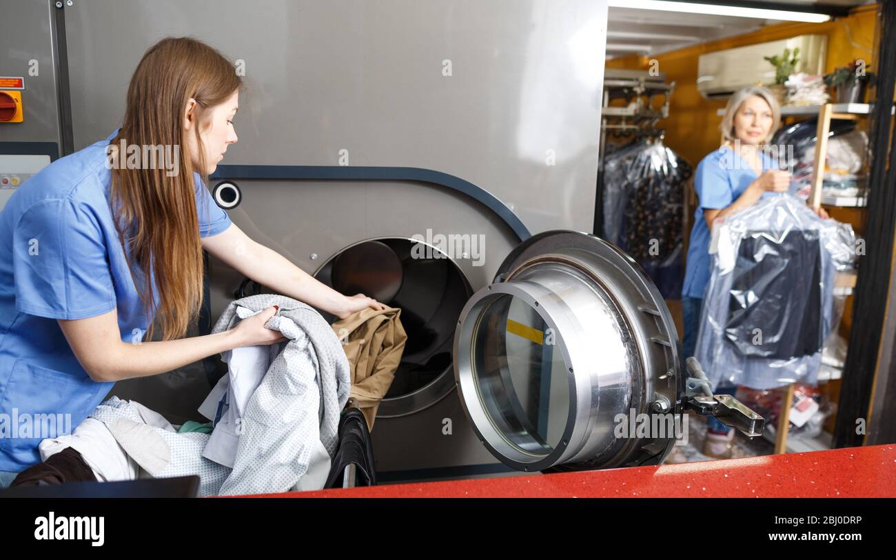 https://c8.alamy.com/comp/2BJ0DRP/two-female-dry-cleaning-salon-employees-in-process-of-work-2BJ0DRP.jpg