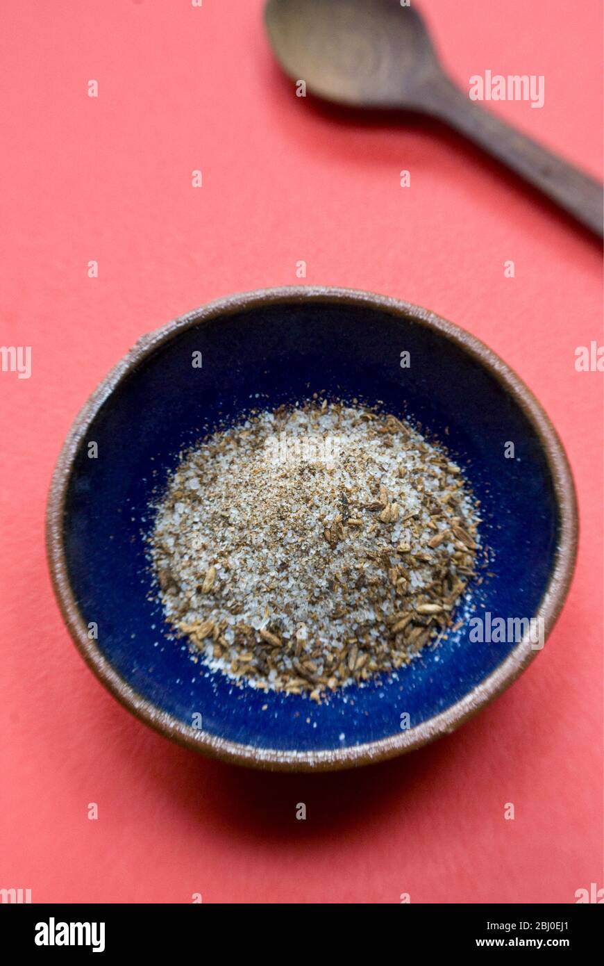 A mixture of sea salt and toasted, crushed cumin seeds, a popular seasoning for Morrocan food. - Stock Photo