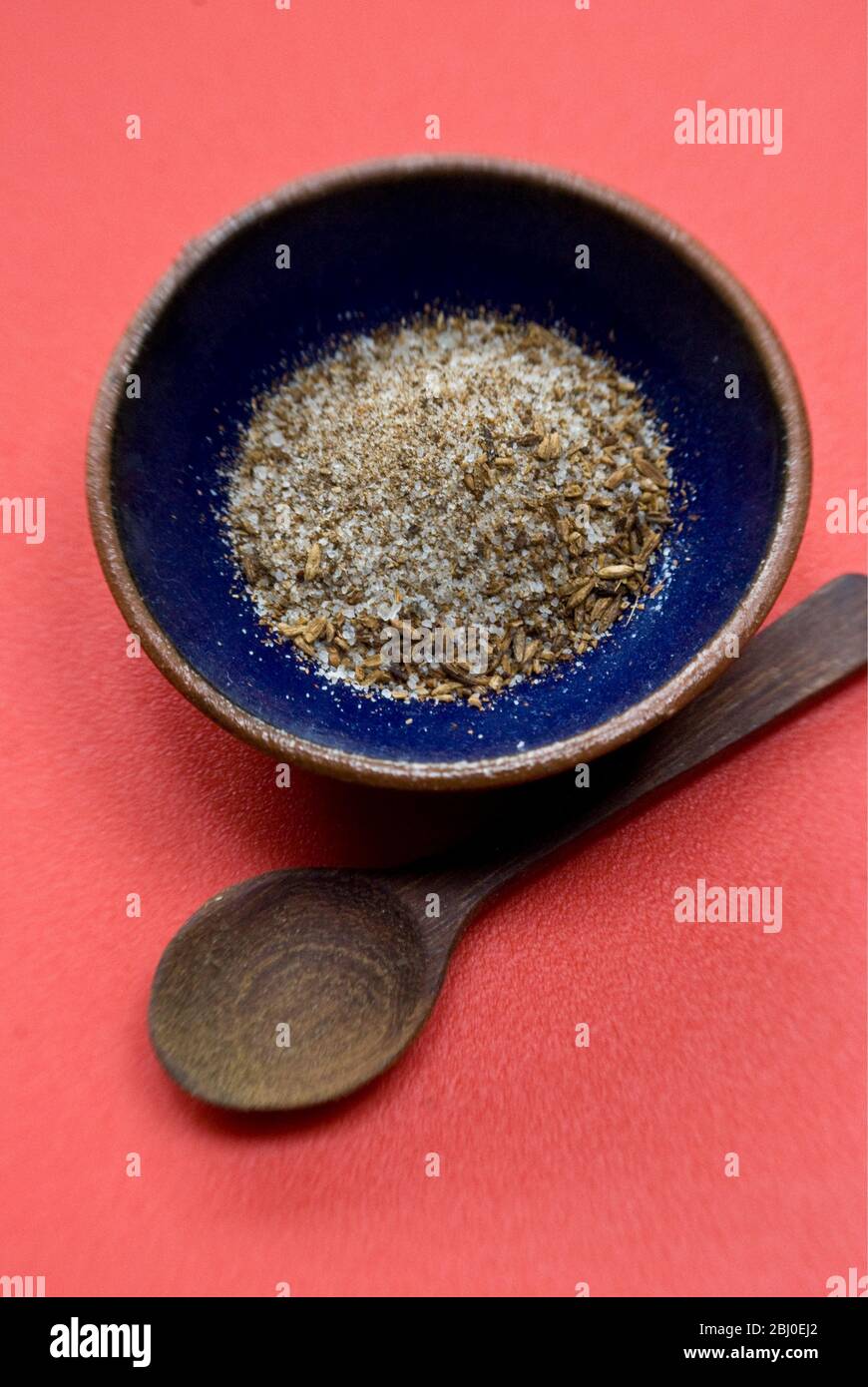 A mixture of sea salt and toasted, crushed cumin seeds, a popular seasoning for Morrocan food. - Stock Photo